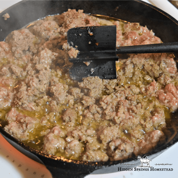Ground Sausage browning in a skillet. Low carb egg muffin recipe. Hidden Springs Homestead