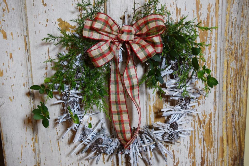 rustic DIY twig wreath on a wall