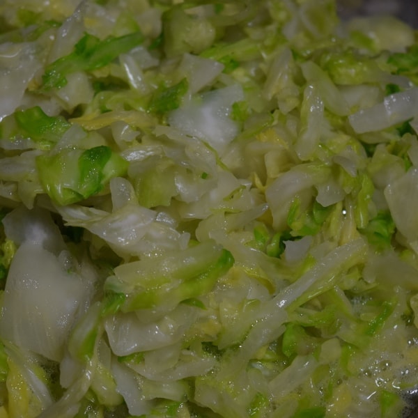 fresh cabbage mashed and limp with   juices ready for making sauerkraut   Hidden Springs Homestead
