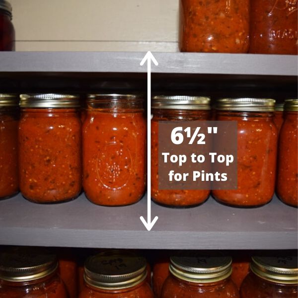 Pints of sauce on canning storage shelf