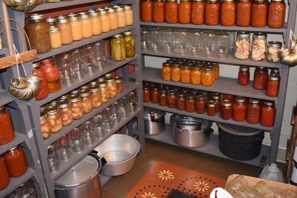storage shelves filled with food in jars