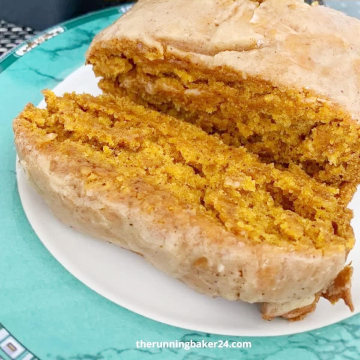 dairy-free pumpkin spice cake sliced laying on a platter