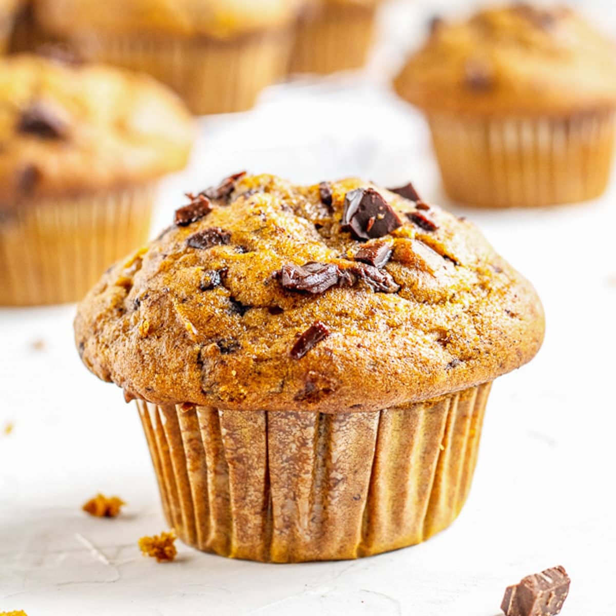 pumpkin muffin from a recipe laying on a white surface
