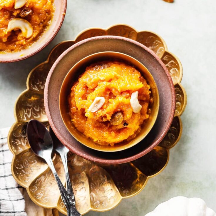 Creamy pumpkin pudding, Halwa in a colorful bowl on a white surface.