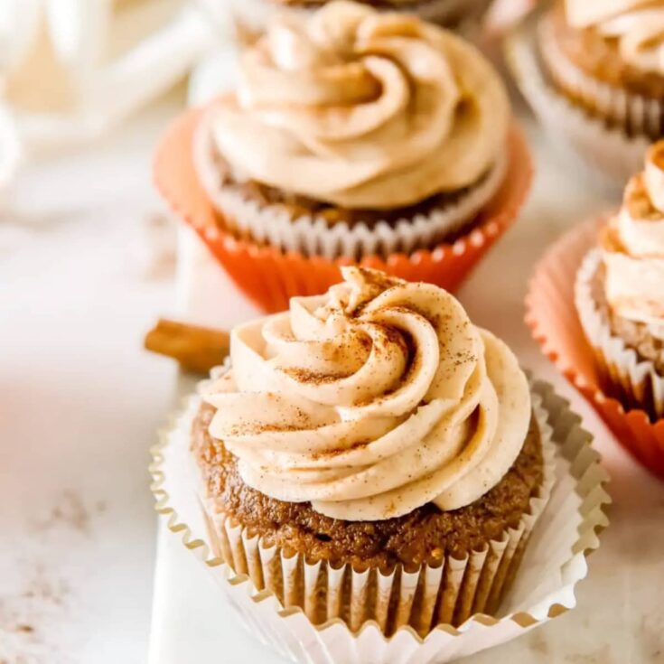pumpkin cucpake with cream cheese frosting on a plate