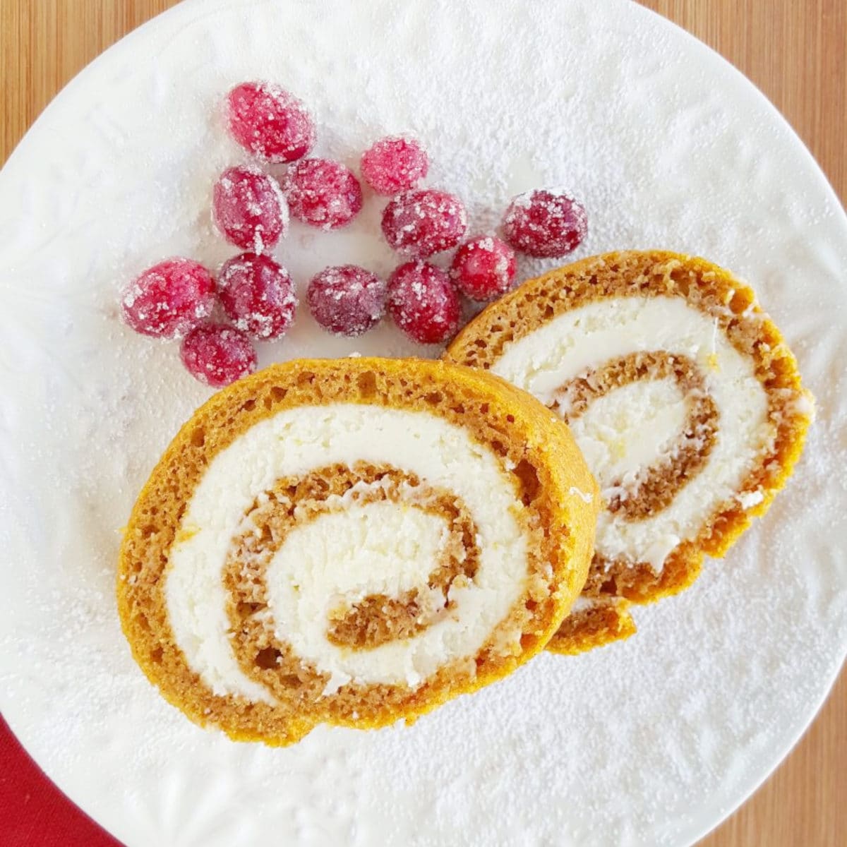 pumpkin roll with red cranberries on the side